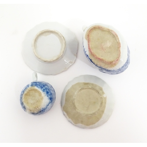 712 - A quantity of blue and white miniature tea wares to include milk jug, sugar bowl, cups and saucers. ... 