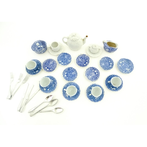 712 - A quantity of blue and white miniature tea wares to include milk jug, sugar bowl, cups and saucers. ... 