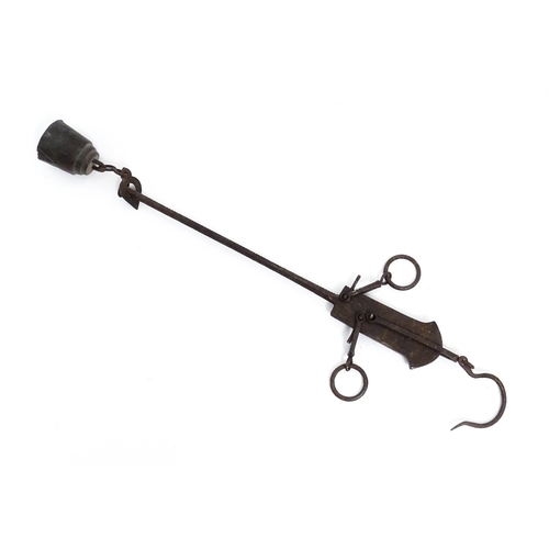 716 - A 20thC balance beam / bar hanging scale with hook and weight. Approx. 14 1/2