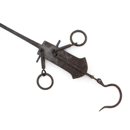 716 - A 20thC balance beam / bar hanging scale with hook and weight. Approx. 14 1/2
