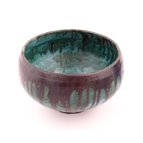 721 - A studio pottery bowl with drip glaze. Signed under R. Berrisford, 1959. Approx. 4 1/2