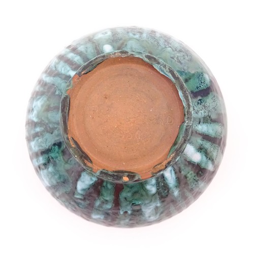 721 - A studio pottery bowl with drip glaze. Signed under R. Berrisford, 1959. Approx. 4 1/2