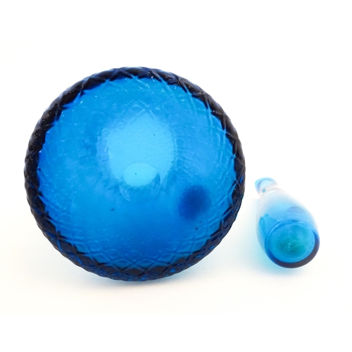 725 - A quantity of turquoise glass to include jugs, glasses etc. Largest jug approx. 7 3/4