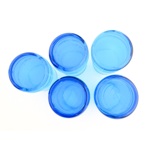 725 - A quantity of turquoise glass to include jugs, glasses etc. Largest jug approx. 7 3/4