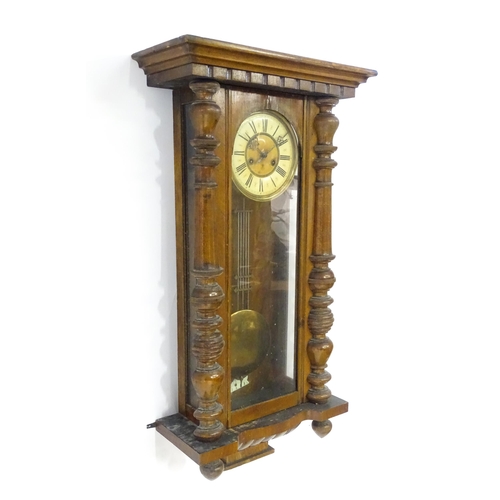 738 - A walnut cased Vienna style wall clock by Gustave Becker. Approx 33