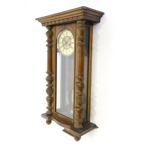 738 - A walnut cased Vienna style wall clock by Gustave Becker. Approx 33