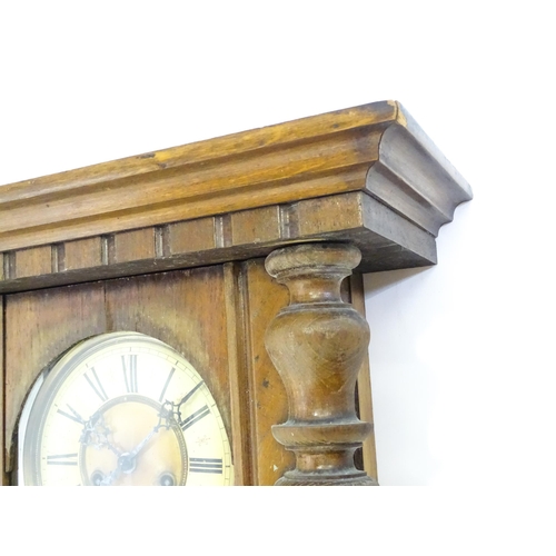 738 - A walnut cased Vienna style wall clock by Gustave Becker. Approx 33