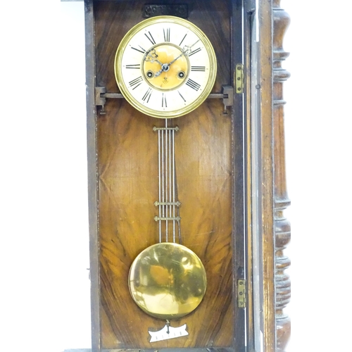 738 - A walnut cased Vienna style wall clock by Gustave Becker. Approx 33