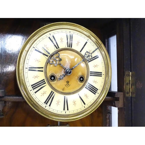 738 - A walnut cased Vienna style wall clock by Gustave Becker. Approx 33