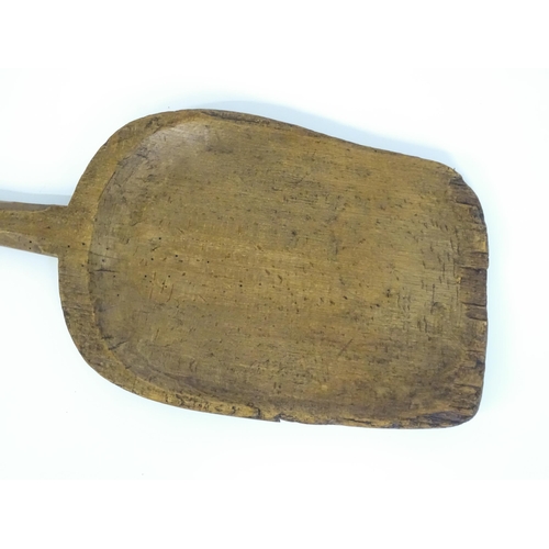 739 - A vintage wooden bakers peel / bread paddle. Approx. 50 1/2