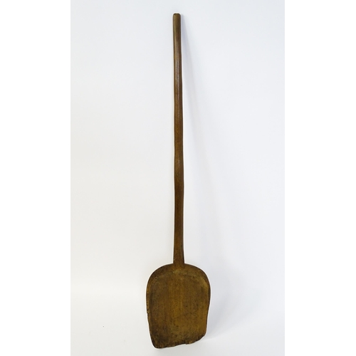 739 - A vintage wooden bakers peel / bread paddle. Approx. 50 1/2