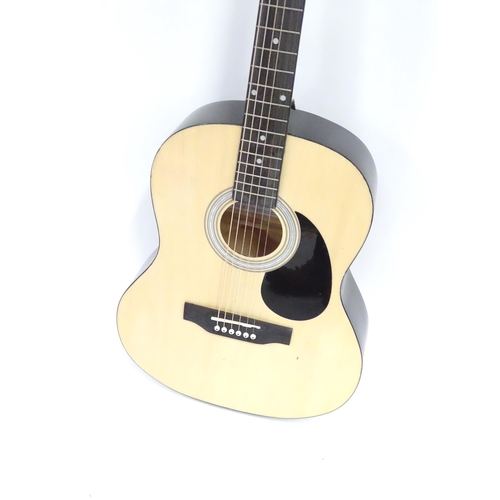781 - Musical Instrument : a Martin Smith W-101-N-PK acoustic guitar, concert scale, approx 29 1/2