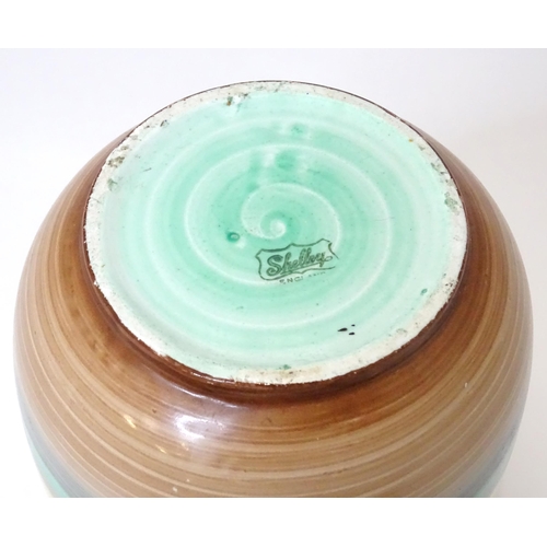 805 - A Shelley vase of tapering form with stripe detail. Marked under. Approx. 9 1/4