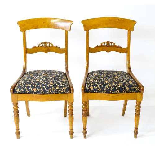 820 - A pair of 19thC side chairs with bowed top rails, carved mid rails, drop in seats and raised on turn... 