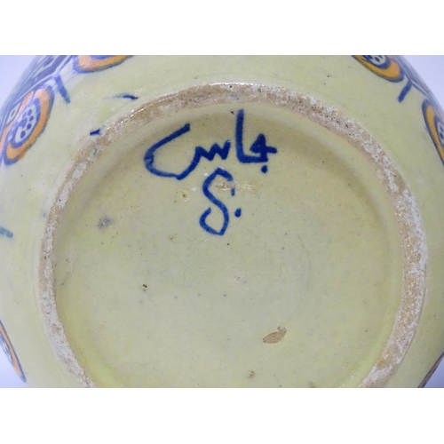 821 - Two ceramic items comprising a Continental dish with flower detail marked Pinto Italia, and a Iznik ... 