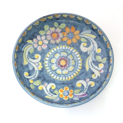 821 - Two ceramic items comprising a Continental dish with flower detail marked Pinto Italia, and a Iznik ... 