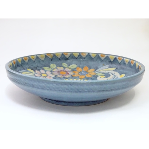 821 - Two ceramic items comprising a Continental dish with flower detail marked Pinto Italia, and a Iznik ... 