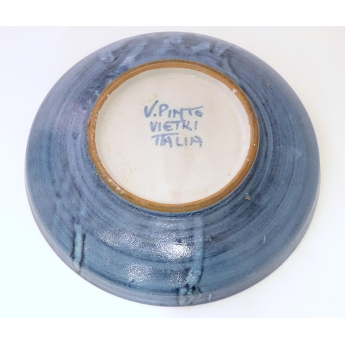 821 - Two ceramic items comprising a Continental dish with flower detail marked Pinto Italia, and a Iznik ... 