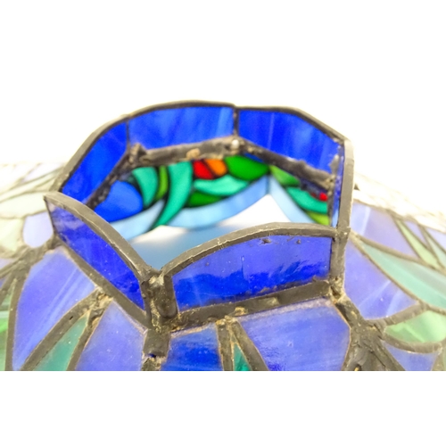 826 - A Tiffany style light shade decorated with flowers and foliage. Approx. 17