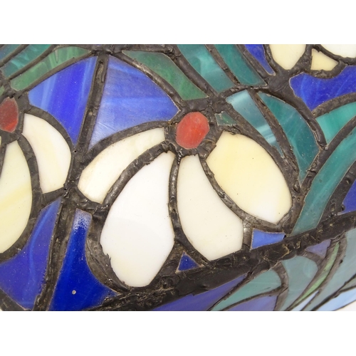 826 - A Tiffany style light shade decorated with flowers and foliage. Approx. 17