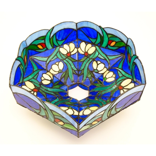826 - A Tiffany style light shade decorated with flowers and foliage. Approx. 17