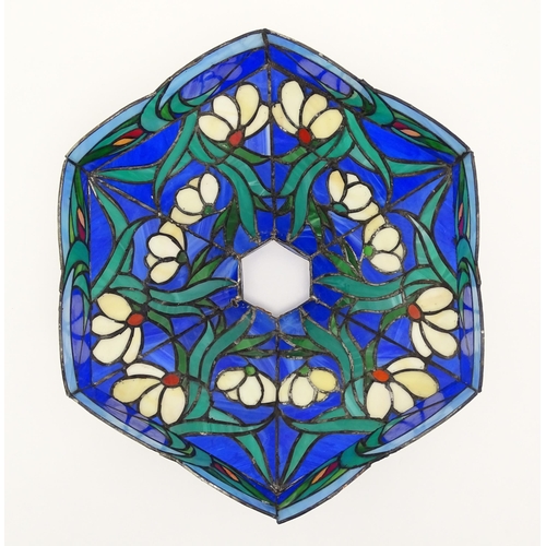 826 - A Tiffany style light shade decorated with flowers and foliage. Approx. 17