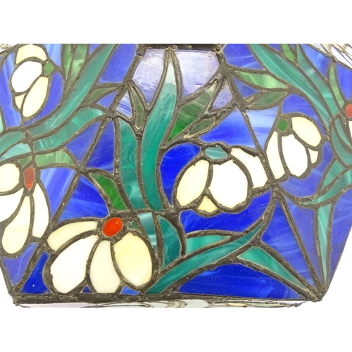 826 - A Tiffany style light shade decorated with flowers and foliage. Approx. 17