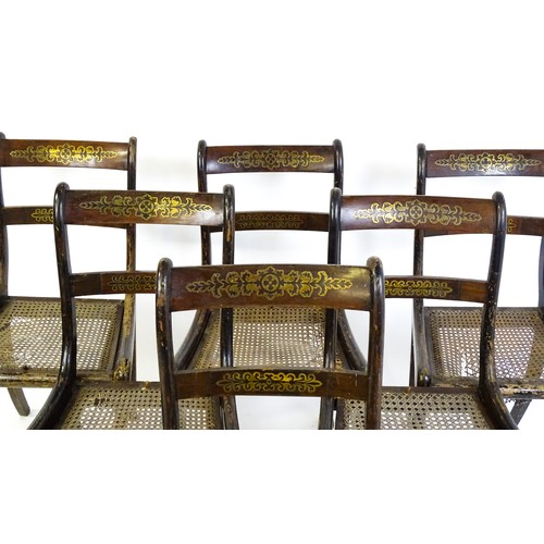 827 - A set of six 19thC brass inlaid dining chairs, with caned seats and drop in seats raised on sabre le... 