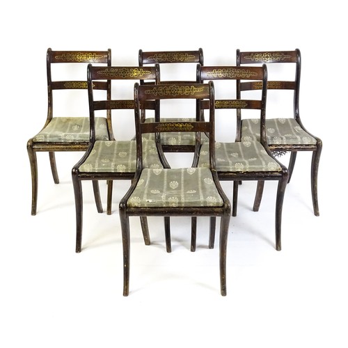 827 - A set of six 19thC brass inlaid dining chairs, with caned seats and drop in seats raised on sabre le... 