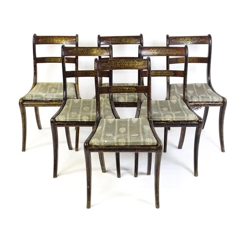 827 - A set of six 19thC brass inlaid dining chairs, with caned seats and drop in seats raised on sabre le... 