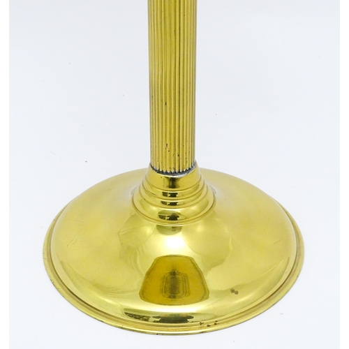836 - A brass oil lamp with column detail and spherical shade. Approx. 28 1/2