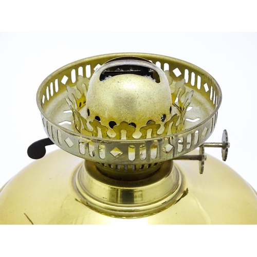 836 - A brass oil lamp with column detail and spherical shade. Approx. 28 1/2