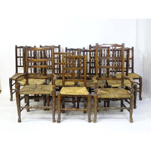 869 - A group of twelve 19thC spindle back dining chairs. Th largest 23