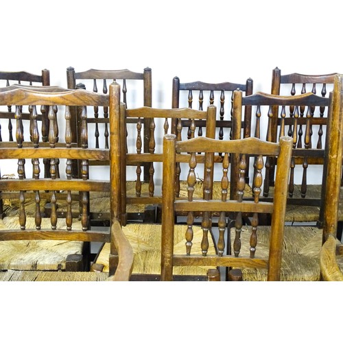 869 - A group of twelve 19thC spindle back dining chairs. Th largest 23