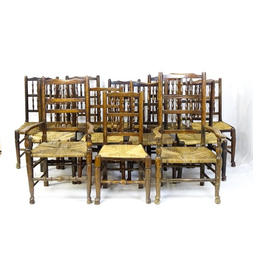 869 - A group of twelve 19thC spindle back dining chairs. Th largest 23