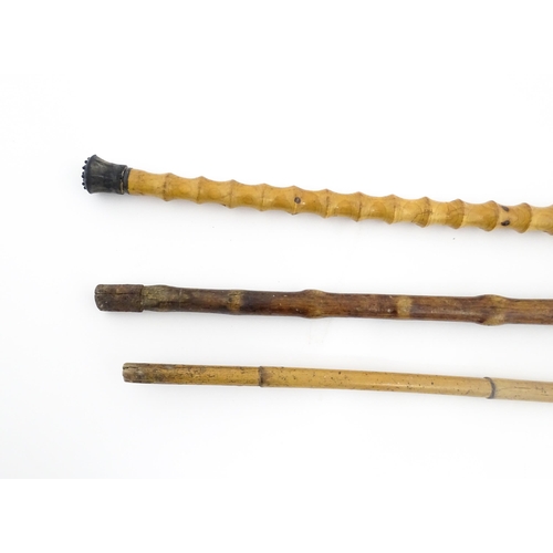 874 - Three assorted walking sticks / canes to include an example with Oriental character marks and scene.... 