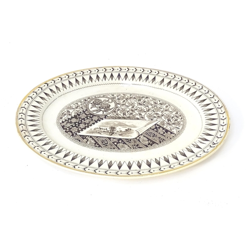 883 - A Victorian oval plate decorated in the Canterbury pattern with vignette landscape scene, flowers, e... 