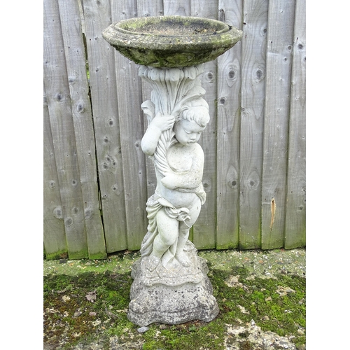 900 - Garden & Architectural : a large reconstituted stone bird bath modelled as a cherub, standing approx... 