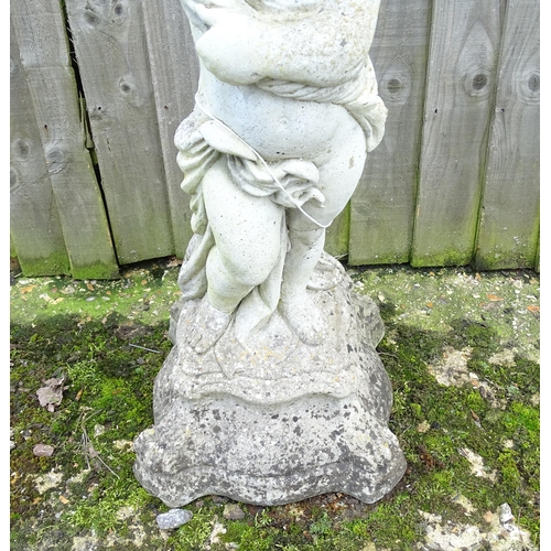 900 - Garden & Architectural : a large reconstituted stone bird bath modelled as a cherub, standing approx... 