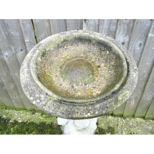 900 - Garden & Architectural : a large reconstituted stone bird bath modelled as a cherub, standing approx... 