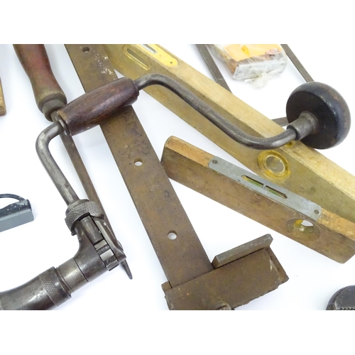 302 - A quantity of mid to late 20thC hand tools , to include saws, drills, planes, vice, socket set, rule... 