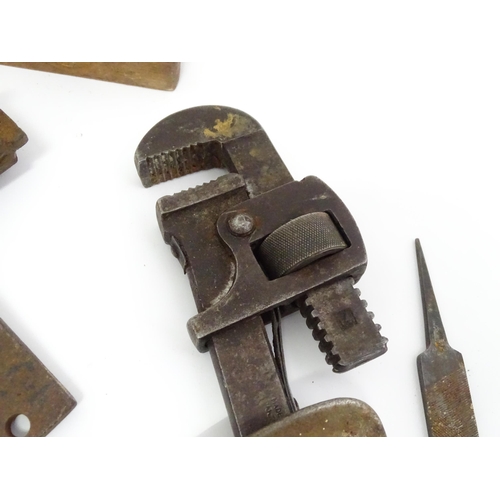 302 - A quantity of mid to late 20thC hand tools , to include saws, drills, planes, vice, socket set, rule... 