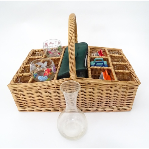 309 - A wicker picnic basket with divisions for bottles, glasses, etc. Together with assorted glasses and ... 