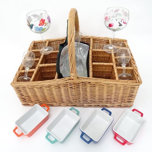 309 - A wicker picnic basket with divisions for bottles, glasses, etc. Together with assorted glasses and ... 