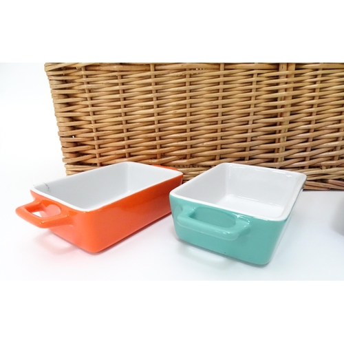 309 - A wicker picnic basket with divisions for bottles, glasses, etc. Together with assorted glasses and ... 