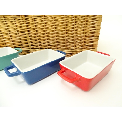 309 - A wicker picnic basket with divisions for bottles, glasses, etc. Together with assorted glasses and ... 