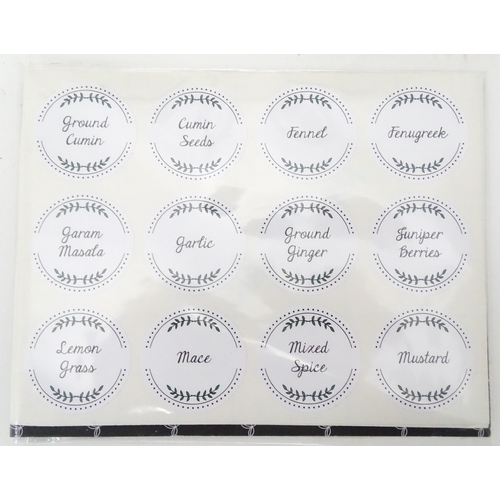 310 - A quantity of glass spice jars together with various spice labels, each jar approx 6