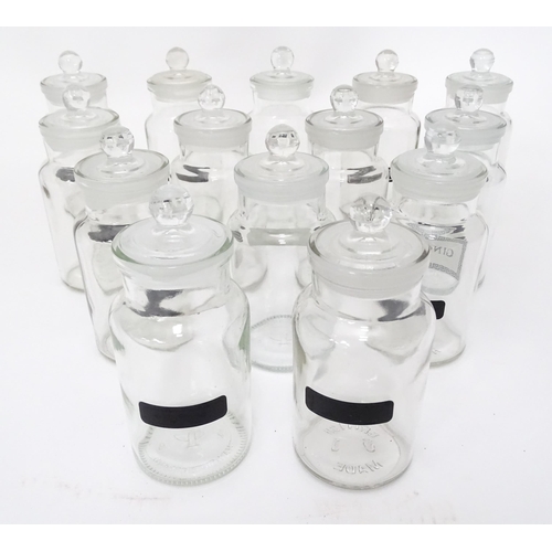 310 - A quantity of glass spice jars together with various spice labels, each jar approx 6