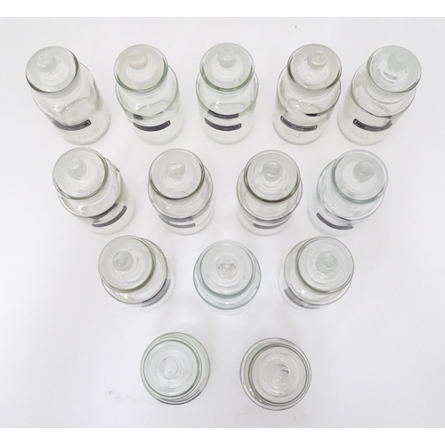 310 - A quantity of glass spice jars together with various spice labels, each jar approx 6