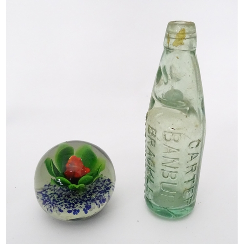 311 - A quantity of miscellaneous items contained within a wooden box to include a paperweight, a codd bot... 